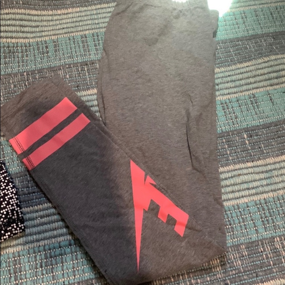 one nike REGULAR leggings and one pair under armour CAPRI leggings